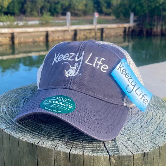 Grey trucker cap says Keezy Life. The letter Y has a boy fishing on the bottom of the Y.