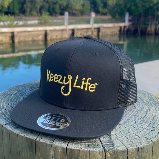 Black Trucker Hat with Waterfront Background